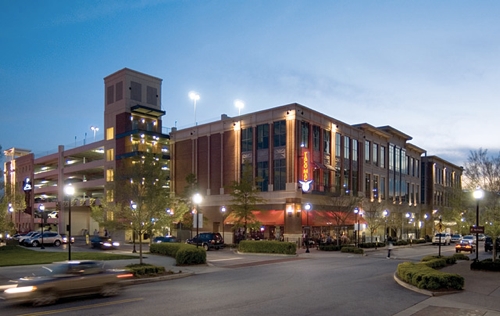 A pedestrian walks through Town Brookhaven, a mixed-use